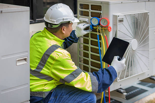 Professional Emergency Hvac Repair technician working in Hillsboro, AL